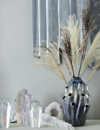 Styling photo of blue Lava Vase, Repeat Mirror and Crystal Rocks